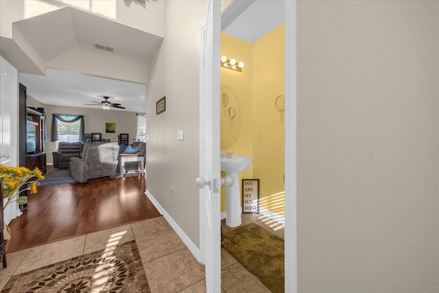 hallway featuring tile patterned floors