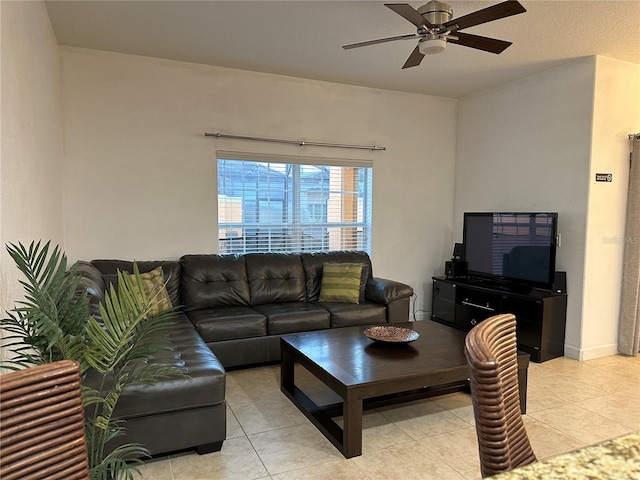 tiled living room with ceiling fan