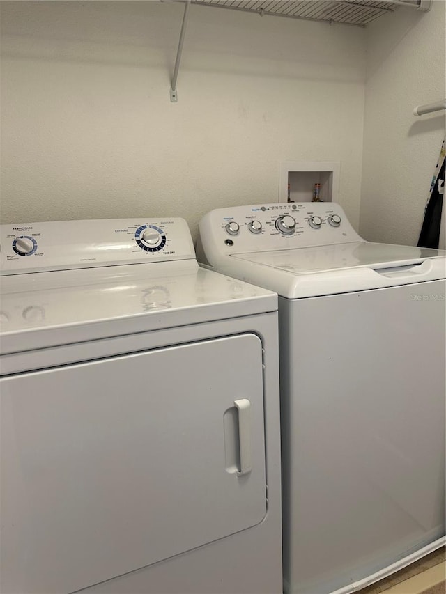 clothes washing area featuring washing machine and dryer