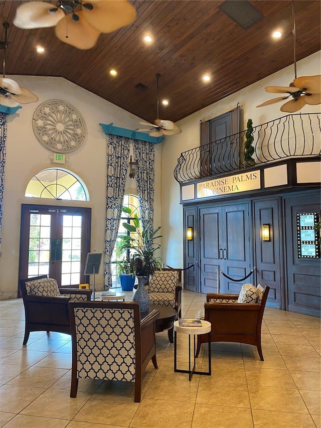 living room with high vaulted ceiling, wooden ceiling, ceiling fan, and light tile patterned flooring