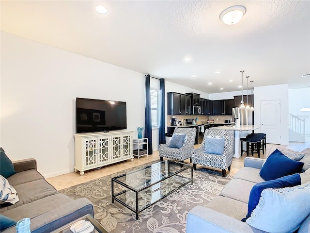 living room with a textured ceiling