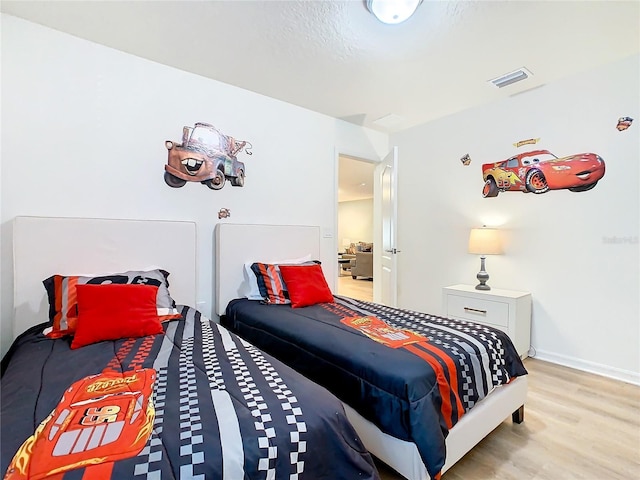 bedroom with light hardwood / wood-style flooring