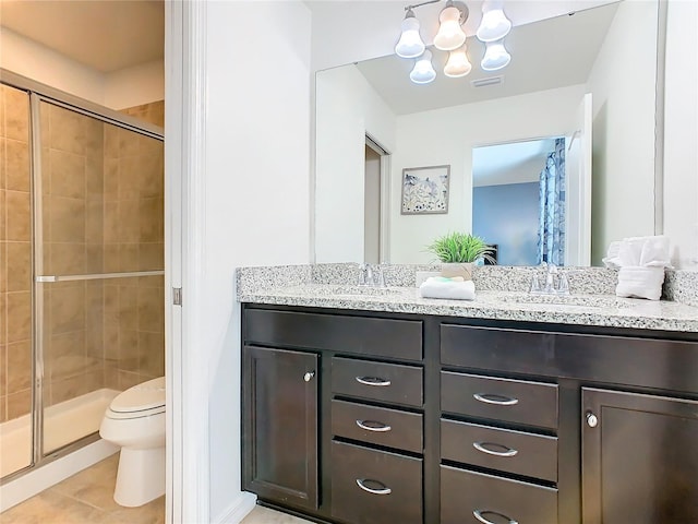 bathroom featuring walk in shower, toilet, a chandelier, vanity, and tile patterned flooring