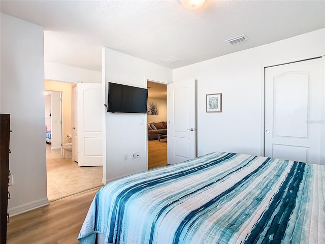 bedroom featuring light wood-type flooring