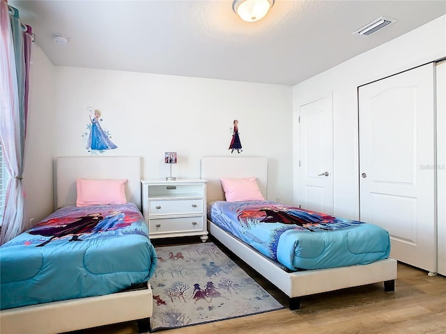 bedroom with light wood-type flooring