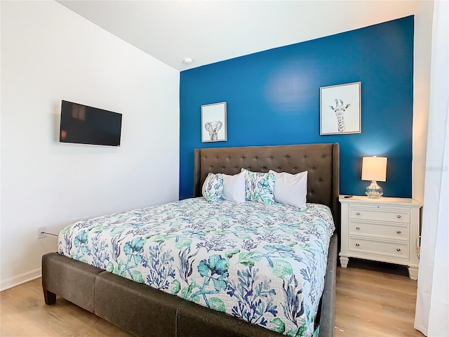 bedroom with light wood-type flooring