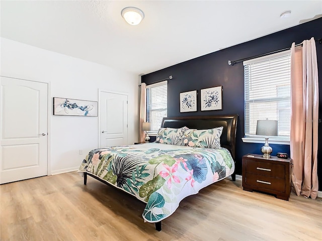 bedroom with light hardwood / wood-style flooring