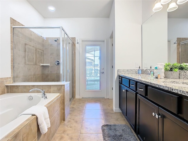 bathroom featuring vanity, separate shower and tub, and tile patterned floors