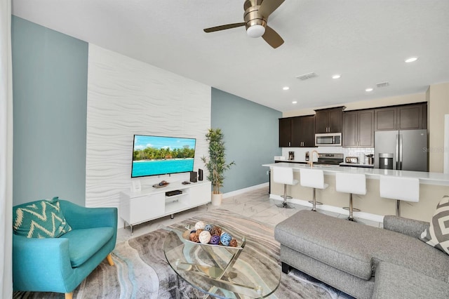 living room with ceiling fan