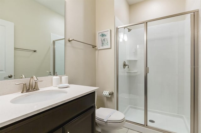 bathroom featuring an enclosed shower, vanity, and toilet