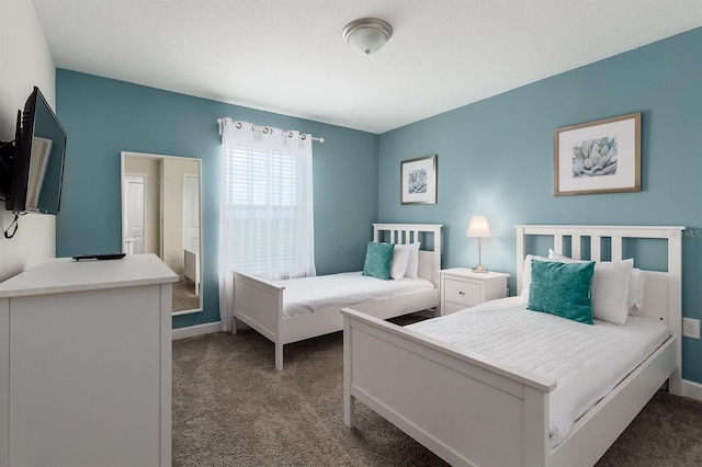 bedroom with dark carpet