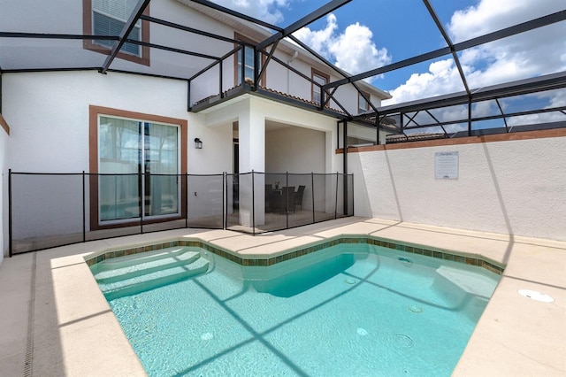 view of swimming pool with glass enclosure