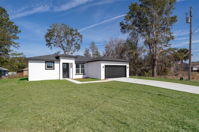 view of front facade with a garage and a front yard