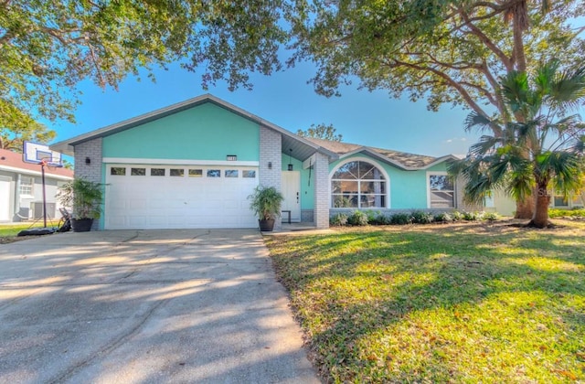 single story home with a garage and a front yard