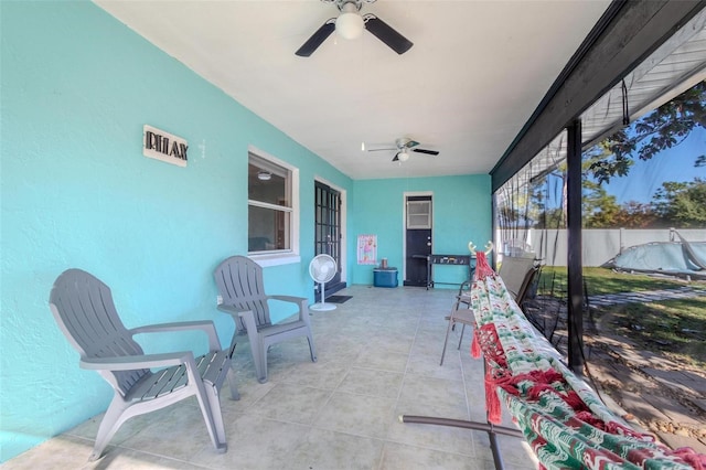 sunroom / solarium with ceiling fan