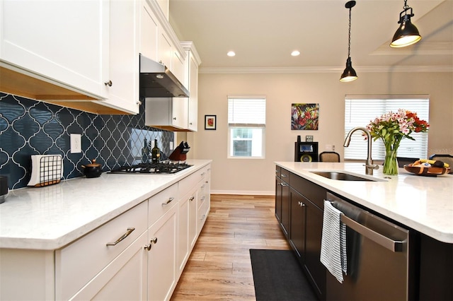 kitchen with sink, white cabinetry, gas stovetop, a center island with sink, and stainless steel dishwasher