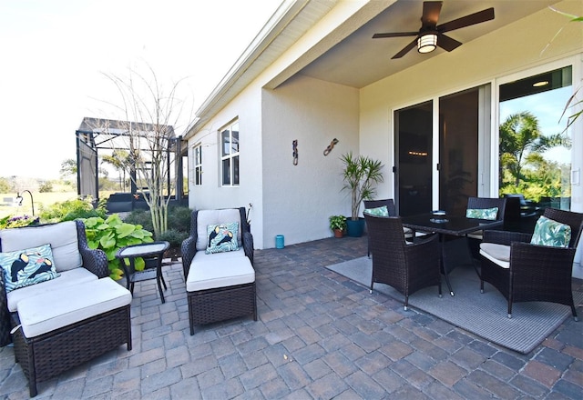 view of patio featuring an outdoor hangout area and ceiling fan