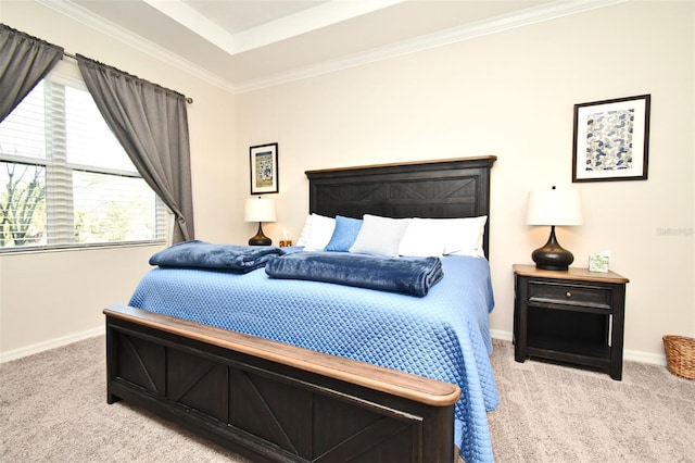 carpeted bedroom featuring ornamental molding and a raised ceiling