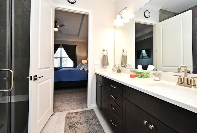 bathroom featuring ornamental molding, vanity, and an enclosed shower