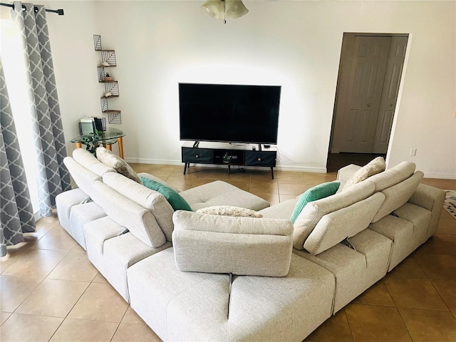 living room with tile patterned flooring