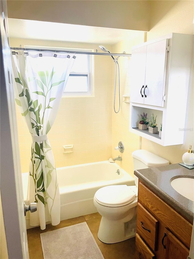 full bathroom featuring shower / tub combo with curtain, vanity, toilet, and tile patterned floors