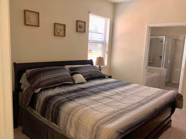 bedroom featuring ensuite bath