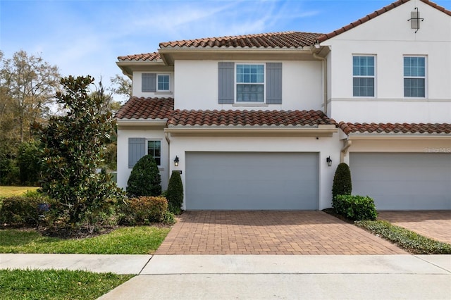 mediterranean / spanish-style house featuring a garage