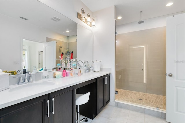 bathroom with vanity, an enclosed shower, and tile patterned flooring