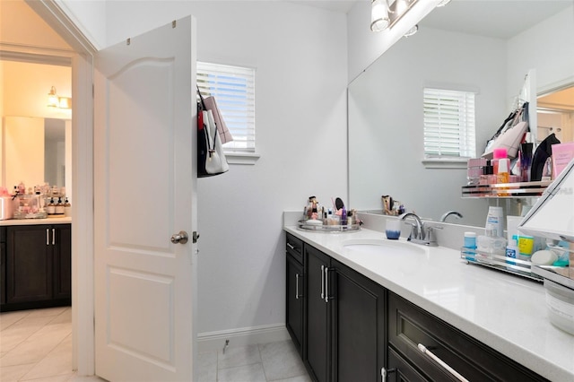 bathroom featuring tile patterned floors and vanity