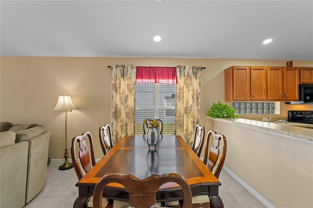 dining area featuring light tile patterned floors