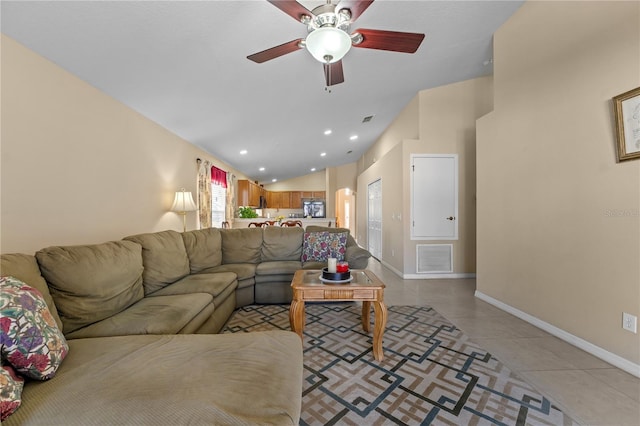 living room with light tile patterned floors, vaulted ceiling, and ceiling fan