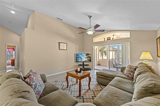 living room featuring light tile patterned flooring, high vaulted ceiling, a textured ceiling, and ceiling fan