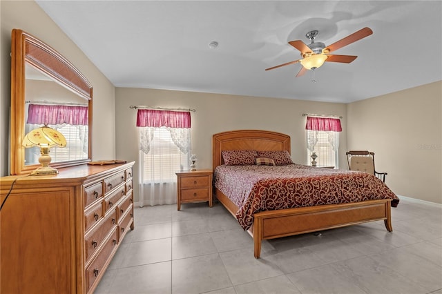 bedroom with light tile patterned floors and ceiling fan