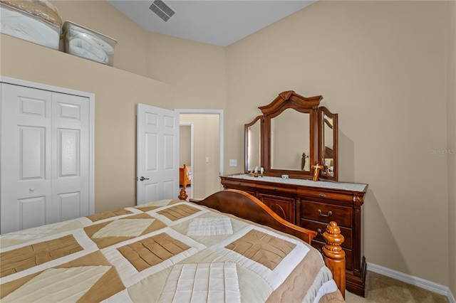 carpeted bedroom with a closet