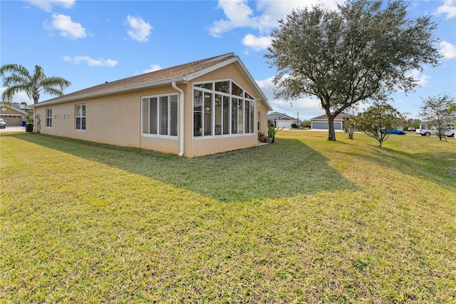 view of home's exterior featuring a yard