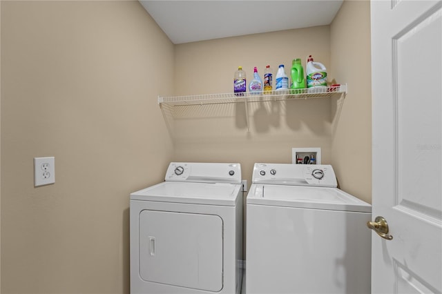 clothes washing area featuring washing machine and dryer