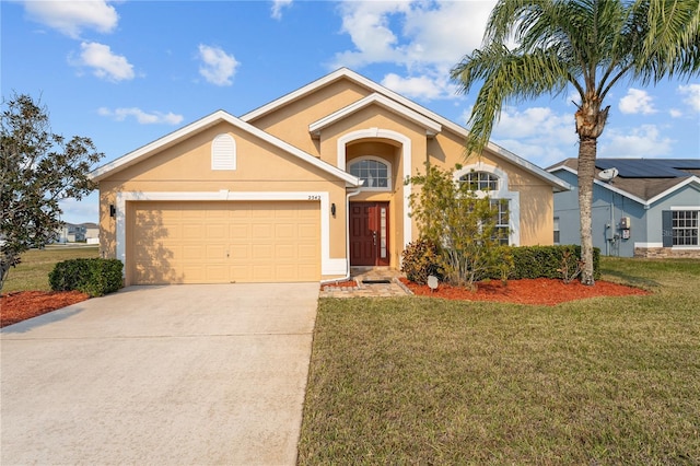 view of front of home featuring a garage and a front yard