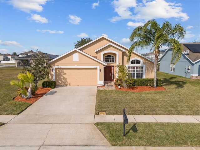 view of front of home with a garage and a front lawn