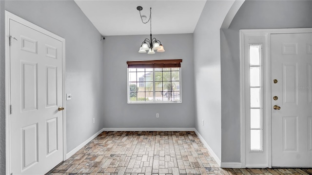 entrance foyer with a chandelier