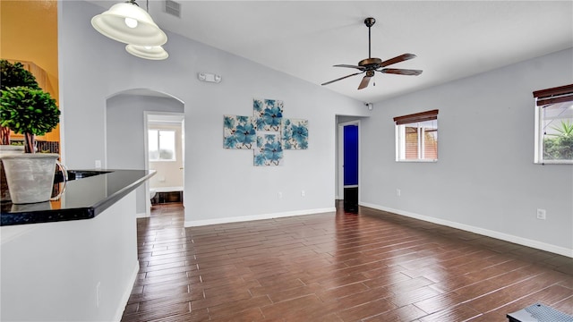 interior space featuring vaulted ceiling and ceiling fan