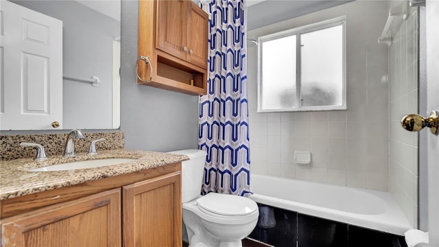 full bathroom with vanity, toilet, and shower / bath combo