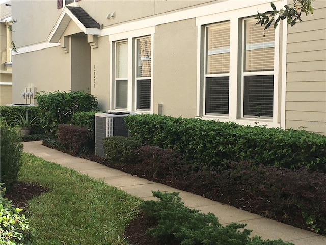 entrance to property featuring cooling unit