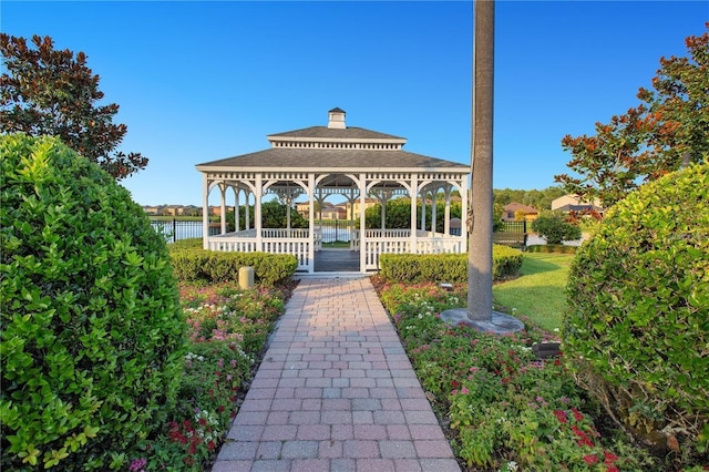 view of community with a gazebo and a water view