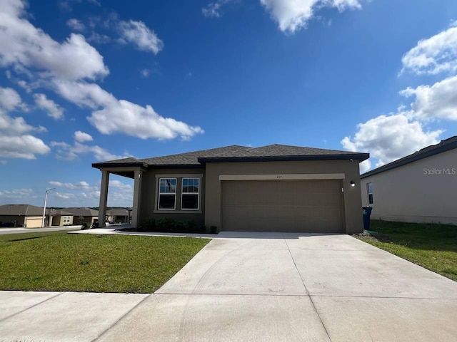 view of front of property featuring a garage, a front lawn, concrete driveway, and stucco siding