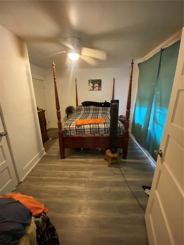 bedroom featuring dark hardwood / wood-style floors and ceiling fan