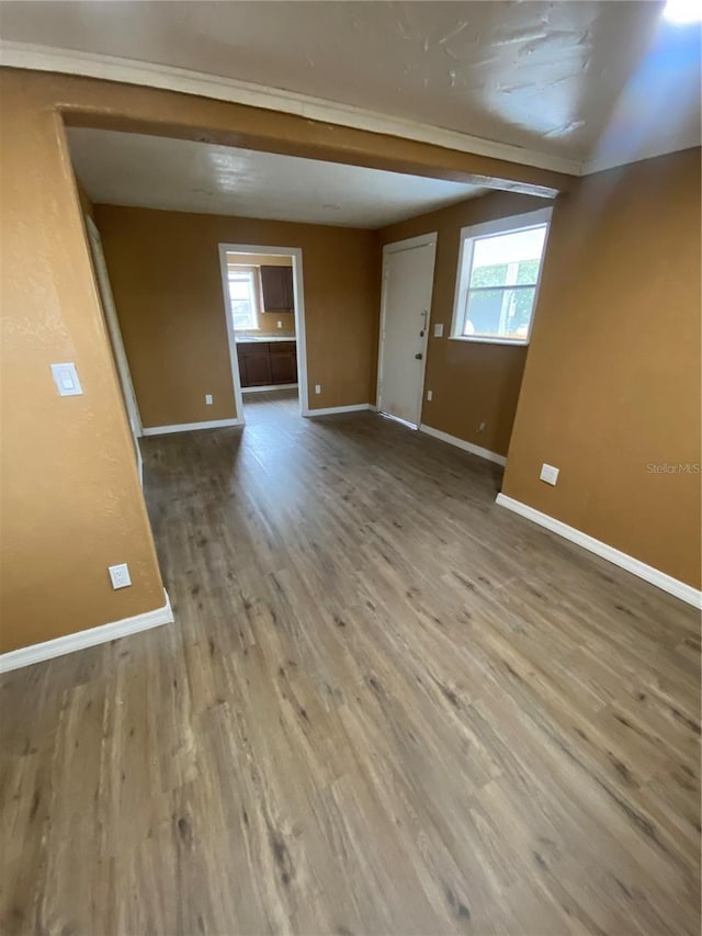 unfurnished room with wood-type flooring