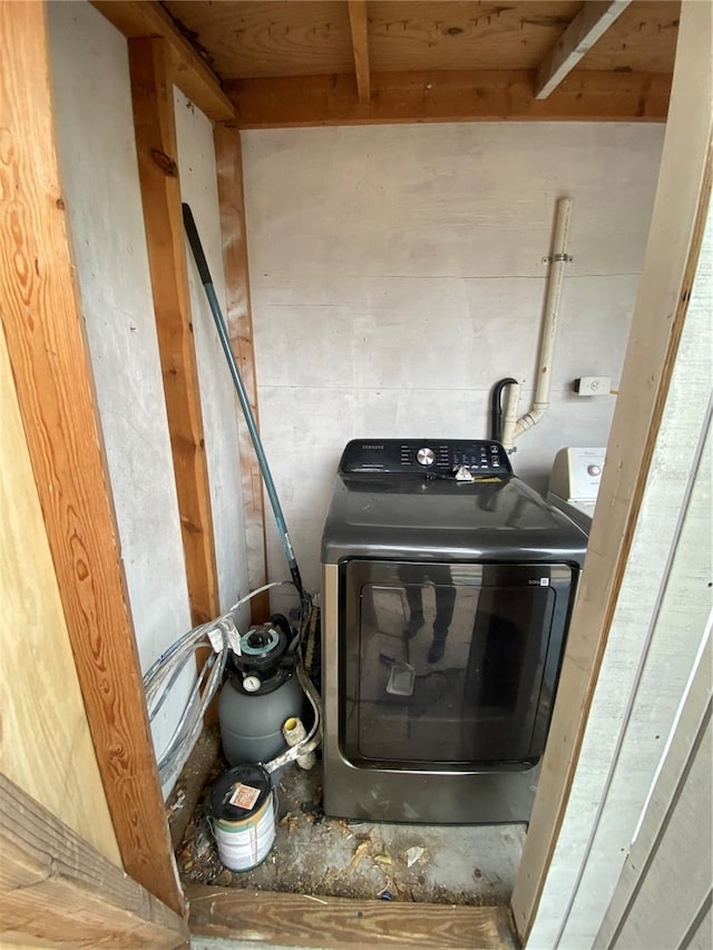 clothes washing area featuring washer and dryer