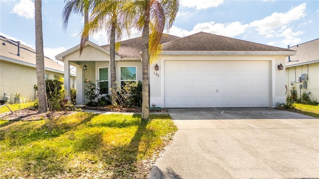 single story home with a garage and a front lawn