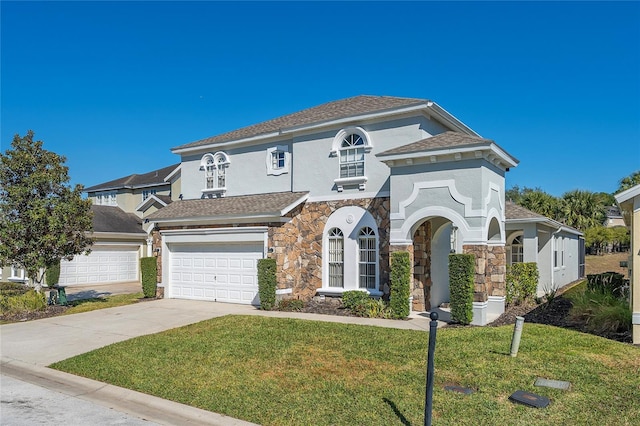 view of front of property with a garage and a front lawn