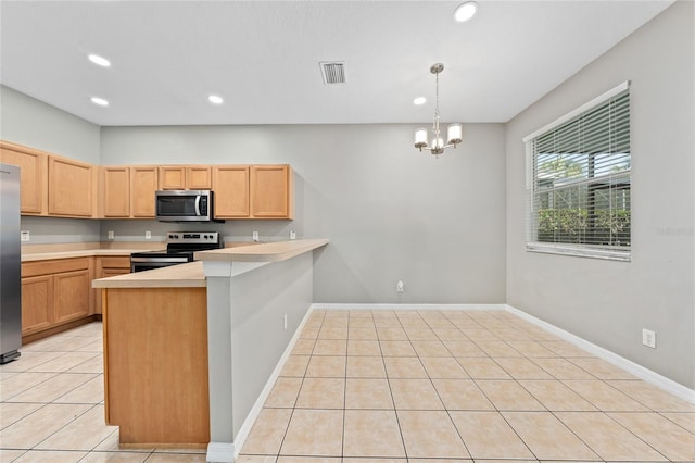 kitchen with pendant lighting, light tile patterned floors, appliances with stainless steel finishes, a notable chandelier, and kitchen peninsula